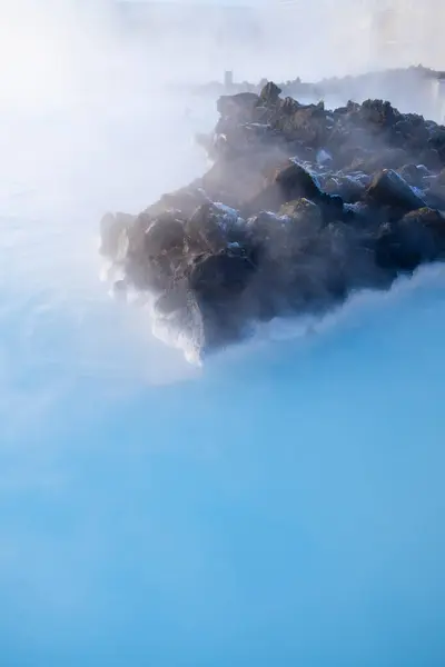 Blue Lagoon, Iceland. Natural background. Geothermal spa for rest and relaxation in Iceland. Warm springs of natural origin. Blue lake and steam.