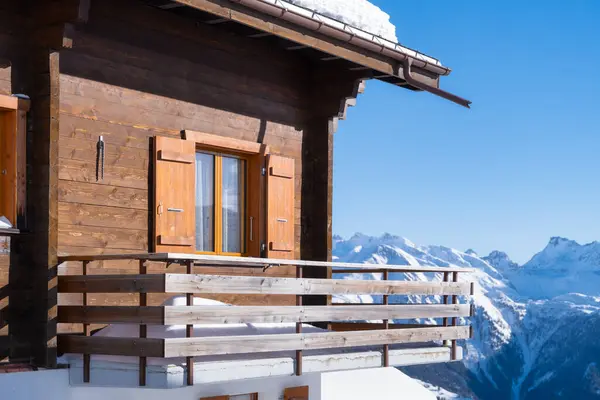 Mountain Chalet Details. Winter vacation. Winter mountain landscape. Wallpaper or background. Cold weather and frost. A place for skiing. Ski resort. High rocks and snow. View of mountains.