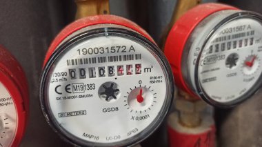 Wroclaw, Polska -  24.07.2024: Mieszkanie w bloku, licznik zuzycia goracej wody.