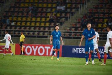 Pathumthani, Tayland - 11 Aralık 2022: Tayland 'daki Thammasat Stadyumu' nda Tayland ile Myanmar arasındaki dostluk maçı sırasında Bordin Phala # 11 Tayland oyuncusu.