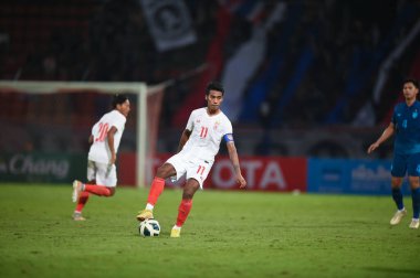 Pathumthani, Thailand - December 11, 2022: Bordin Phala #11 Player of Thailand during friendly match between Thailand against Myanmar at Thammasat stadium in Thailand. clipart