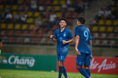 Pathumthani, Thailand - December 11, 2022: Bordin Phala #11 Player of Thailand during friendly match between Thailand against Myanmar at Thammasat stadium in Thailand. clipart