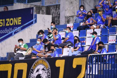 THANYABURI, PATHUMTHANI, THAILAND - 6 NOVEMBER, 2021:Fans of bg pathum during thaileague2021 between bgpu against buriram at leo stadium,thailand clipart