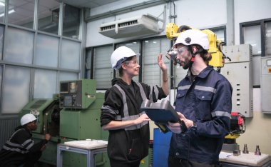 Engineering working in the robotics factory