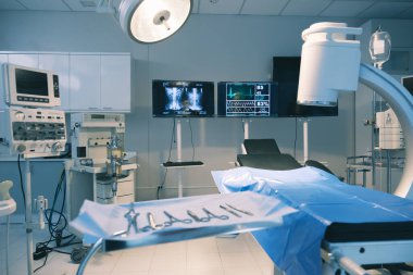 Empty operating room with bed and medical equipped in a hospital