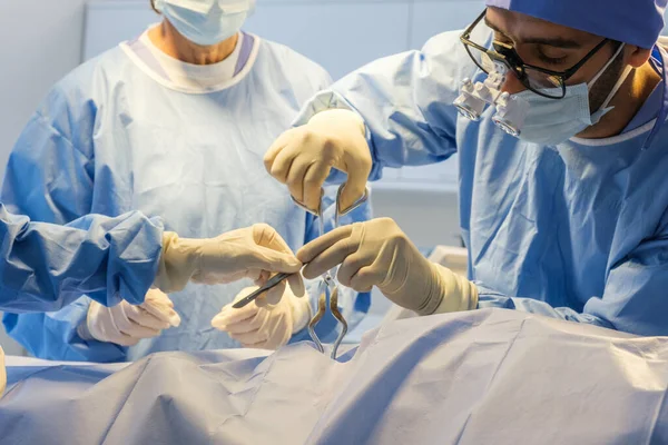 The medical team operated on the patient in the operating room of the hospital.