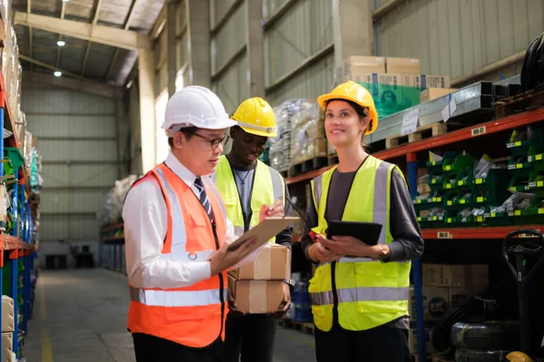 stock image Group of Industrial worker working at warehose factory.