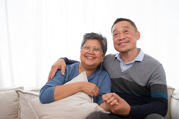 Doctor examination and giving hope with elderly patient at home.
