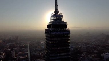 Experience the beauty of Mexico City from above at sunrise in this stunning drone footage. The video captures the impressive Torre Latinoamericana and the iconic Palacio de Bellas Artes, with warm colors illuminating the city.