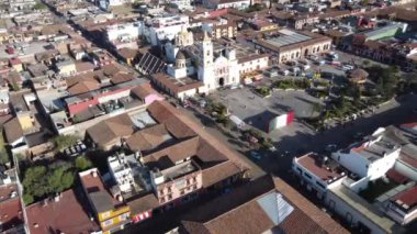 Chignahuapan, Puebla Mexico. Nov 23 2022. Panoramic drone view of the indigenous Baroque church Parroquia de Santiago Apstol in the central Plaza de Armas.