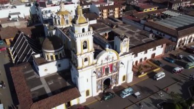 Chignahuapan, Puebla Mexico. Nov 23 2022. Panoramic drone view of the indigenous Baroque church Parroquia de Santiago Apstol in the central Plaza de Armas.