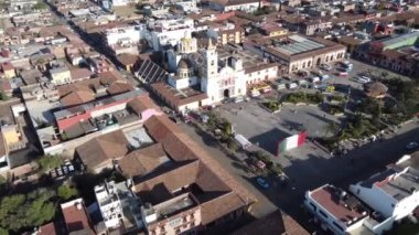 Chignahuapan, Puebla Mexico. Nov 23 2022. Panoramic drone view of the indigenous Baroque church Parroquia de Santiago Apstol in the central Plaza de Armas.