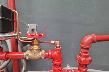 Pressure gauge for measuring installed in water system on technology background