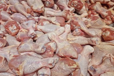 Fresh chicken meat turned into pieces on food background