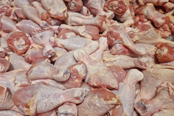 Fresh chicken meat turned into pieces on food background