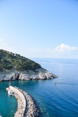 Beautiful rough blue sea with waves and sandy beach. Beautiful day in Greece