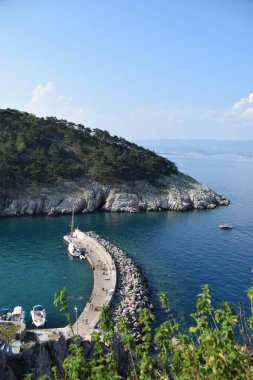Beautiful rough blue sea with waves and sandy beach. Beautiful day in Greece