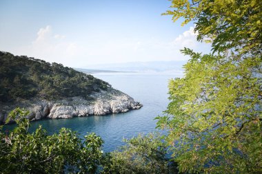 Beautiful rough blue sea with waves and sandy beach. Beautiful day in Greece