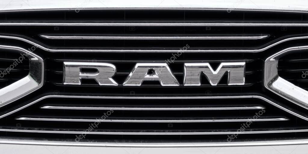 Senden, Germany - June, 04, 2025: Closeup of a RAM logo on the grille of a white car. Panoramic image.