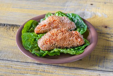 Portion of Sesame Crusted Salmon on lettuce