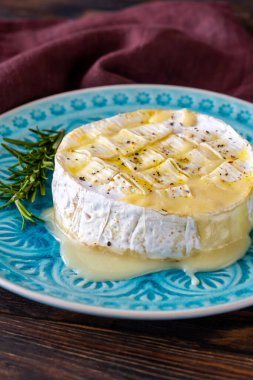 Baked Camembert cheese on the serving plate