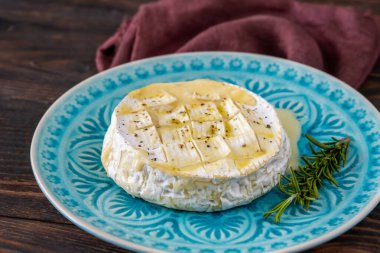 Baked Camembert cheese on the serving plate