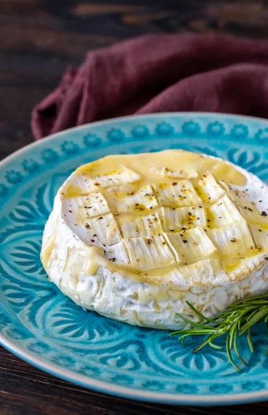 Baked Camembert cheese on the serving plate
