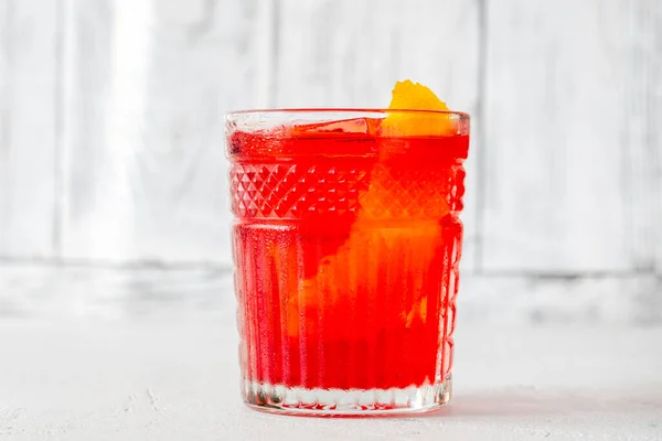 stock image Glass of Negroni cocktail garnished with orange peel