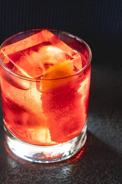 stock image Glass of Negroni cocktail garnished with orange peel