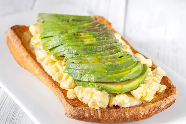 Sandwich with ciabatta, scrambled eggs and avocado
