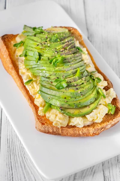 Sandwich with ciabatta, scrambled eggs and avocado