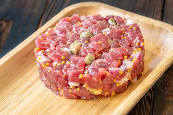 Portion Beef Steak Tartare Wooden Plate Stock Picture