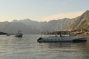 Bay of Kotor during sunset.Boats are moored on the water. Kotor, Montenegro
