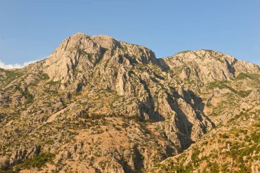 Mountain peaks over Bay of Kotor during sunset. Kotor city. Montenegro