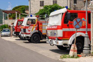 Perast, Montenegro - June 6, 2022: Historic fire car on waterfront town of Perast. Kotor Bay in Montenegro