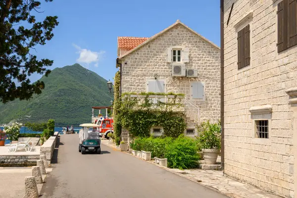 Perast, Montenegro - June 6, 2022: Seaside promenade in the picturesque town of Perast in Montenegro