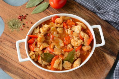 Hungarian turkey stew in tomato sauce and red pepper clipart