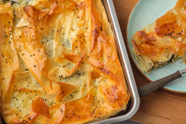 stock image Spinach and feta pie in filo pastry. Crispy spinach feta cheese phyllo pastry pie