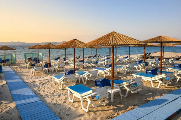 Sun loungers on sandy beach of Marmari. The Greek island of Kos