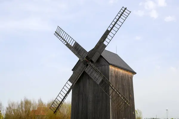 stock image Mokry Dwor, Poland - April 7, 2024: Traditional wooden paltrak windmill in Mokry Dwor village. Educational Farm in Zulawy. Poland
