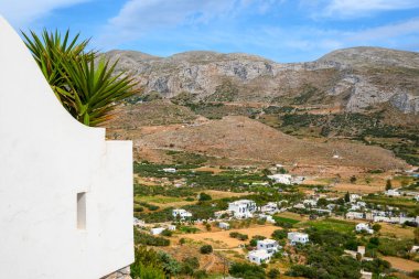 Aegiali village surrounded by mountains on the island of Amorgos. Greece clipart