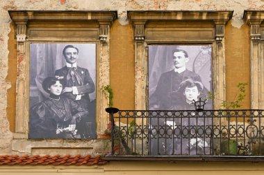 Lublin, Poland - September 13, 2022: Burgher tenement house with photos of former residents in the Old Town of Lublin. Poland. clipart