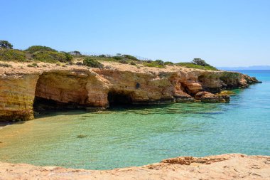 Rocky coast of the island of Ano Koufonisi. Small Cyclades, Greece clipart