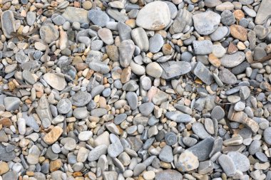 The shore of a pebble beach. Pavlos beach on the island of Amorgos. Greece
