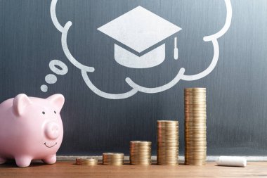 Student loan and tuition. Saving money for education. Stack of coins and piggy bank. Academic cap icon and thought balloon drawn on blackboard