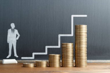 Salary increase and promotion. Drawing of businessman and steps. Blackboard and stack of coins.