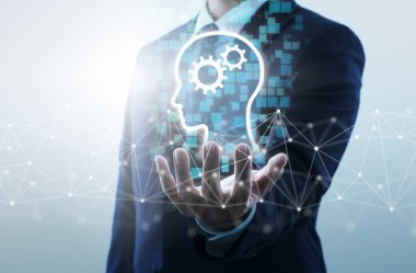 İş bilgisi için teknolojik çözümler. İş adamı ağ yapısını ve baş simgeyi tutuyor