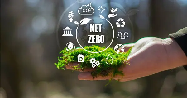 stock image Net zero icon and carbon neutral concept in the hand for net zero greenhouse gas emissions target Climate neutral long term strategy on a green background 