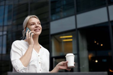 Beautiful Woman Talking On Phone on a lunch break