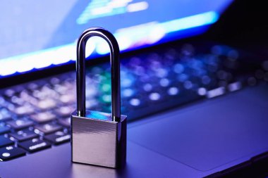 The lock on the computer laptop in purple colors